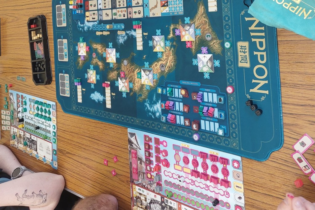 Nippon Zaibatsu game in progress, showing mat and two player boards