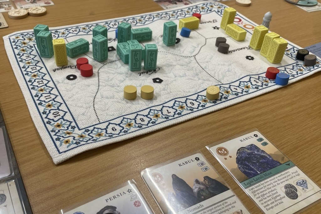 Pax Pamir game in progress, showing mat and cards